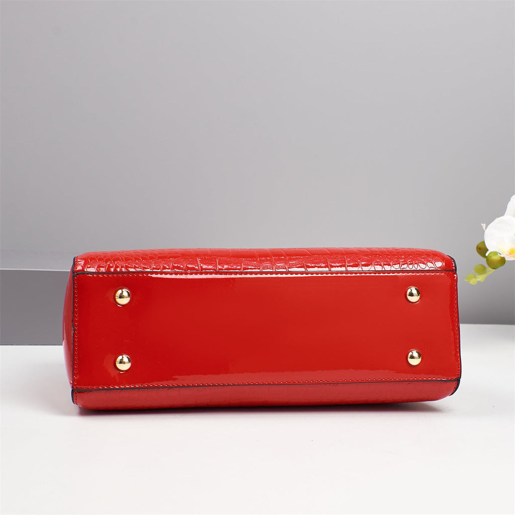 La Vendomia | Bolso tote clásico efecto cocodrilo con doble asa y detalles dorados.